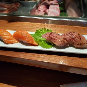 Sushi Den - New zealand king salmon... 12 for 2 pieces . I wouldve paid 15 and wouldnt complain - Japanese Near Me - Denver, Colorado