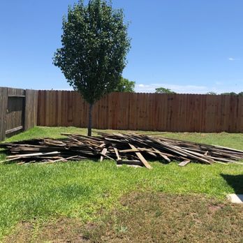 Kenny's Junk Houston - a pile of wood in the yard - Home Cleaning Near Me Kenny's Junk Houston - a pile of wood in the yard - Home Cleaning Near Me