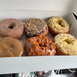 Portias Donut's - From top left: vanilla cinnamon, Samoa, lemon chiffon, blueberry with maple glaze, pumpkin crumble, and lemon chiffon