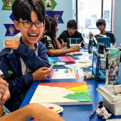 Fibo Kids Art Academy - A Masters student having fun with their peers