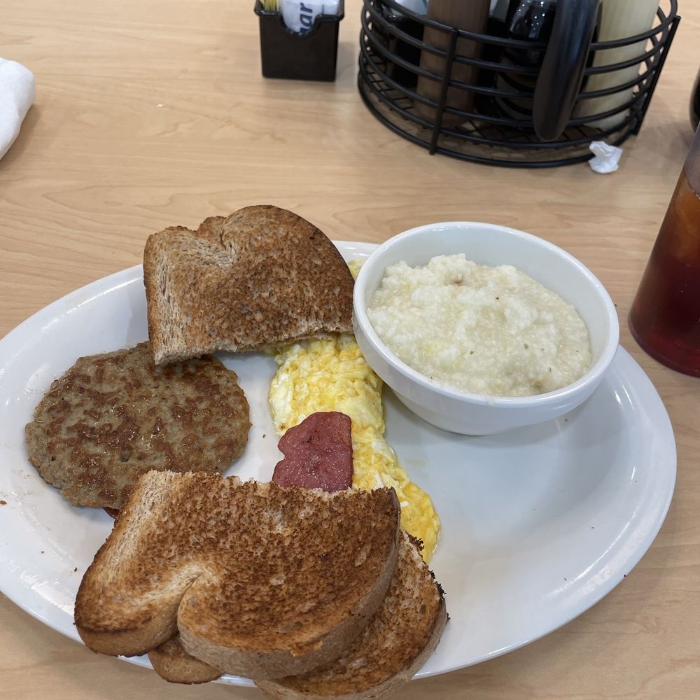 Eggs Up Grill - A Classic: grits, cheese eggs, turkey and turkey bacon. - Breakfast & Brunch Near Me - Jacksonville, North Carolina Eggs Up Grill - A Classic: grits, cheese eggs, turkey and turkey bacon. - Breakfast & Brunch Near Me - Jacksonville, North Carolina