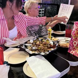 Hamburger Mary's - Kansas City - The many different games of bingo list and pork nachos.