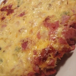 Spanish Omelette is enough for two people with medium shrimp, house potatoes, chorizo, ham, and onions inside.