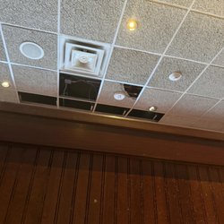 Missing ceiling tiles in one section of the restaurant