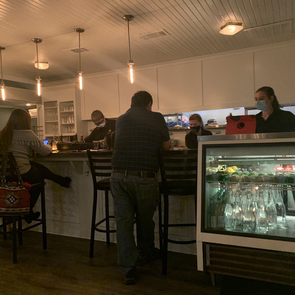 Bryans On 290 - a group of people sitting at a bar - New American Near Me - Johnson City, Texas