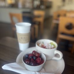 Rise Grind & Ride Espresso Cafe - Everything bowl w/fruit and a black coffee