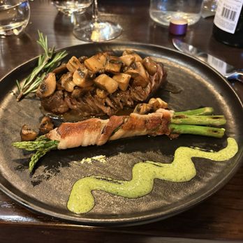 Miro Spanish Grille - A filet with asparagus wrapped in bacon. - Steakhouses Near Me - Charlotte, North Carolina
