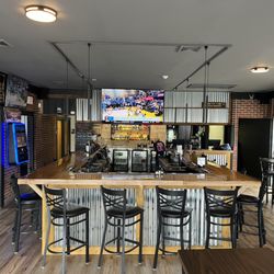 The Score Sports Grille - Several large screen TVs with cozy atmosphere