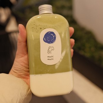 Machi Machi - a hand holding a bottle of juice - Bubble Tea Near Me - Flushing, New York