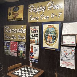 J J's Tavern - Advertisements by restrooms