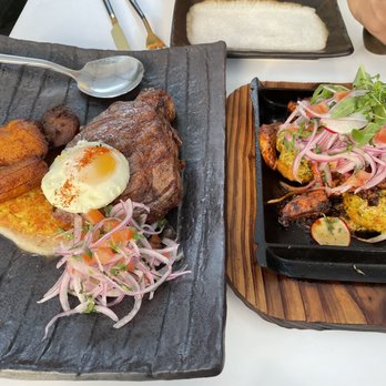 INTIMO - Left: steak over crispy Lima bean mix; right: seared octopus over potatoes - Peruvian Near Me - Miami Beach, Florida INTIMO - Left: steak over crispy Lima bean mix; right: seared octopus over potatoes - Peruvian Near Me - Miami Beach, Florida