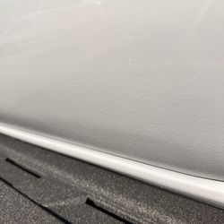 Unique Auto Body - Grainy feel and doesn't look like the rest of the paint.