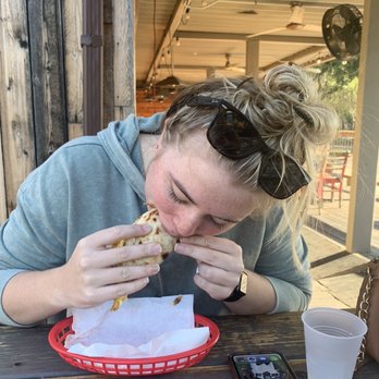 Taco Joint - Sister eating a yummy breakfast taco! - Mexican Near Me - Austin, Texas Taco Joint - Sister eating a yummy breakfast taco! - Mexican Near Me - Austin, Texas
