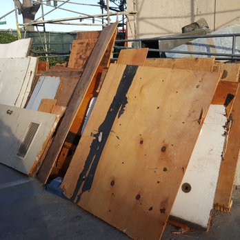 Buildaworks - a pile of old doors and windows - General Contractors Near Me Buildaworks - a pile of old doors and windows - General Contractors Near Me