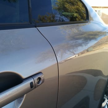 LEVEL Paintless Dent Removal - Before repair. Door ding near door on rear quarter panel. - Mobile Dent Repair Near Me