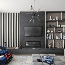 SetupTeam - Expert wall-mounted TV install above fireplace by Setup Team - secure mount, neat cable concealment, and sleek modern finish.