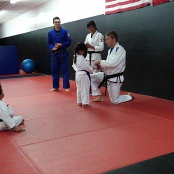 SBG SoCal - Kalia receiving a stripe from Master Jon. - Karate Near Me - Pasadena, California SBG SoCal - Kalia receiving a stripe from Master Jon. - Karate Near Me - Pasadena, California
