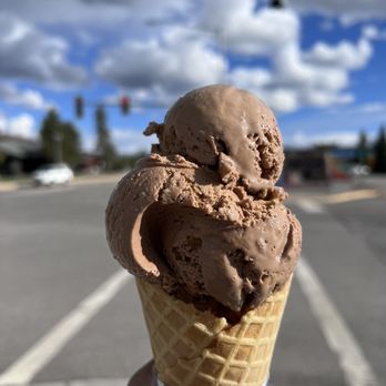 Expresso West - a hand holding a cone of ice cream - Coffee & Tea Near Me - West Yellowstone, Montana Expresso West - a hand holding a cone of ice cream - Coffee & Tea Near Me - West Yellowstone, Montana