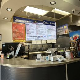 a counter with menus on it a counter with menus on it