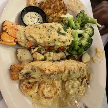 Angie's Seafood - Seafood platter: shrimp, stuffed lobster, crab cake, potatoes and broccoli. The sauce over the shrimp was excellent! Yummy! - Seafood Near Me - Baltimore, Maryland