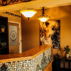 Hands On HealthCare Massage Therapy and Wellness Day Spa - The distinctive mosaic reception desk and welcoming entry area at Hands On HealthCare in Commack.