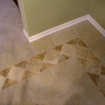 MAD Renovations - a tile floor in a bathroom - General Contractors Near Me - Cincinatti, Ohio MAD Renovations - a tile floor in a bathroom - General Contractors Near Me - Cincinatti, Ohio