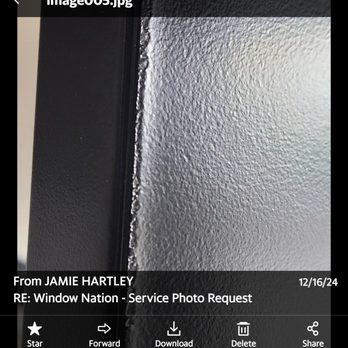 Window Nation Chicago - The image shows a close-up of a textured wall surface with a black border or trim along the left side. The wall has a rough, stippled texture, and the photo appears to be taken indoors. The top part of the image includes an email interface with the sender's name, date, and options for actions like download and delete. The email subject references a service request for Window Nation. - Windows Installation Near Me - Romeoville, Illinois