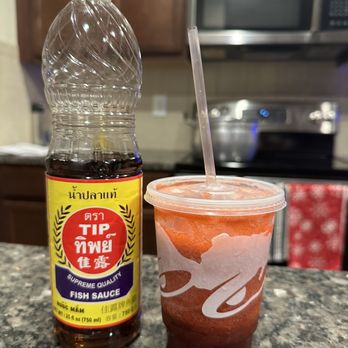 Taco Bell - Watermelon Berry Freeze next to Fish Sauce for scale. - Fast Food Near Me - Cumming, Georgia
