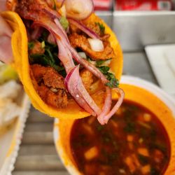 El Cabo Pepe's - Close-up shot of the birria taco and consomme