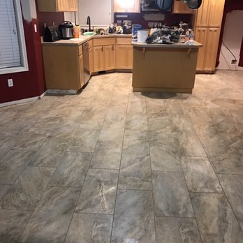 Cascade Flooring America - Kitchen and dining after tile install (base is not complete in this photo but now the room is full of furniture) - Carpeting Near Me - Vancouver, Washington Cascade Flooring America - Kitchen and dining after tile install (base is not complete in this photo but now the room is full of furniture) - Carpeting Near Me - Vancouver, Washington