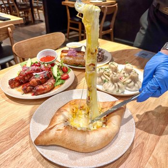 Bevri - Khachapuri Adjaruli - the infamous boat shaped cheese bread - Georgian Near Me - Los Altos, California Bevri - Khachapuri Adjaruli - the infamous boat shaped cheese bread - Georgian Near Me - Los Altos, California