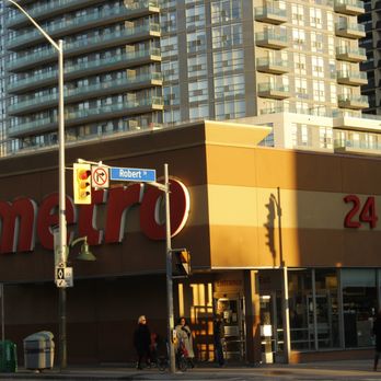Metro - people crossing the street in front of a store - Grocery Near Me - Toronto, Ontario Metro - people crossing the street in front of a store - Grocery Near Me - Toronto, Ontario