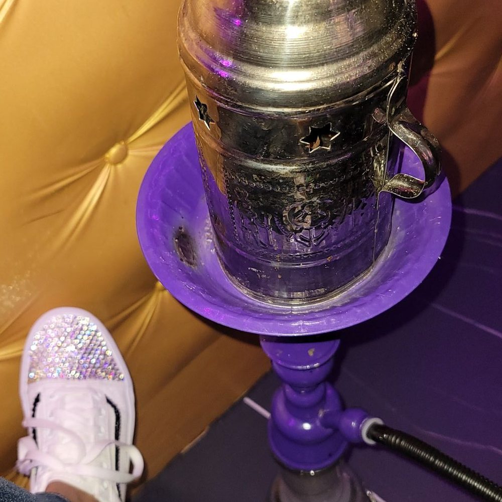 Royalty Bar & Lounge - a person's feet on a purple table - Lounges Near Me - Humble, Texas Royalty Bar & Lounge - a person's feet on a purple table - Lounges Near Me - Humble, Texas