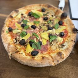 Dough It Up - Capriccosa Pizza; red sauce, mozzarella, Prosciutto, mushrooms, black olives, artichoke hearts and fresh basil.