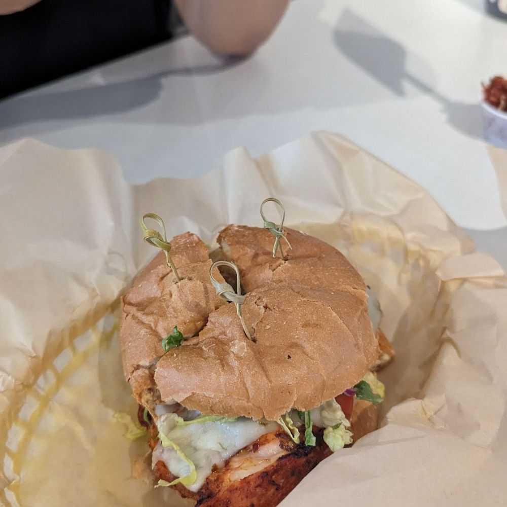 Our chicken burger cut into thirds Our chicken burger cut into thirds