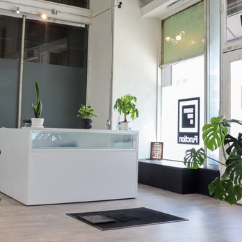 Function Fitness - Bright, airy reception area with a place to wipe down shoes and lush green plants - Trainers Near Me - Los Angeles, California
