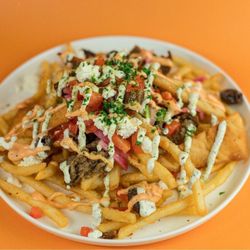 Santorini's Greek Grill - Sandy - The Zeus at Santorini's Sandy: Fries topped with gyro meat, feta, and Doner Aioli. A favorite at The Commons at Southtowne!