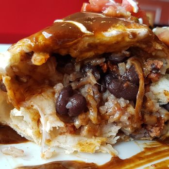 El Tio Mexican Restaurant - Burrito Al Pastor wet with Molé cross section - Mexican Near Me - Berwyn, Pennsylvania El Tio Mexican Restaurant - Burrito Al Pastor wet with Molé cross section - Mexican Near Me - Berwyn, Pennsylvania