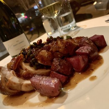 Potager - ORNER POST FARM WOOD OVEN CHICKEN ROULADE and rosemary potatoes, olives, almonds, dates, capers, parsley and lemon pan jus - New American Near Me - Denver, Colorado