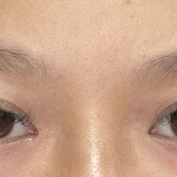 She’s Lash Studio  - Sexy style, 11-14mm, d curl - A detailed view of a person's eyes featuring eyelash extensions, well-shaped eyebrows, and natural skin tone. - Eyelash Service Near Me - Brooklyn, New York