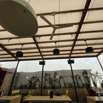 Pour Company - There are misters ready for the hot days connected to a fan. - New American Near Me - Fullerton, California