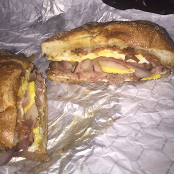 Deli & Brew - Breakfast sandwiches made fresh - made to order. This is double egg, bacon, ham, pepperjack and red onion on a fresh hard roll. #Score - Pizza Near Me - Troy, New York