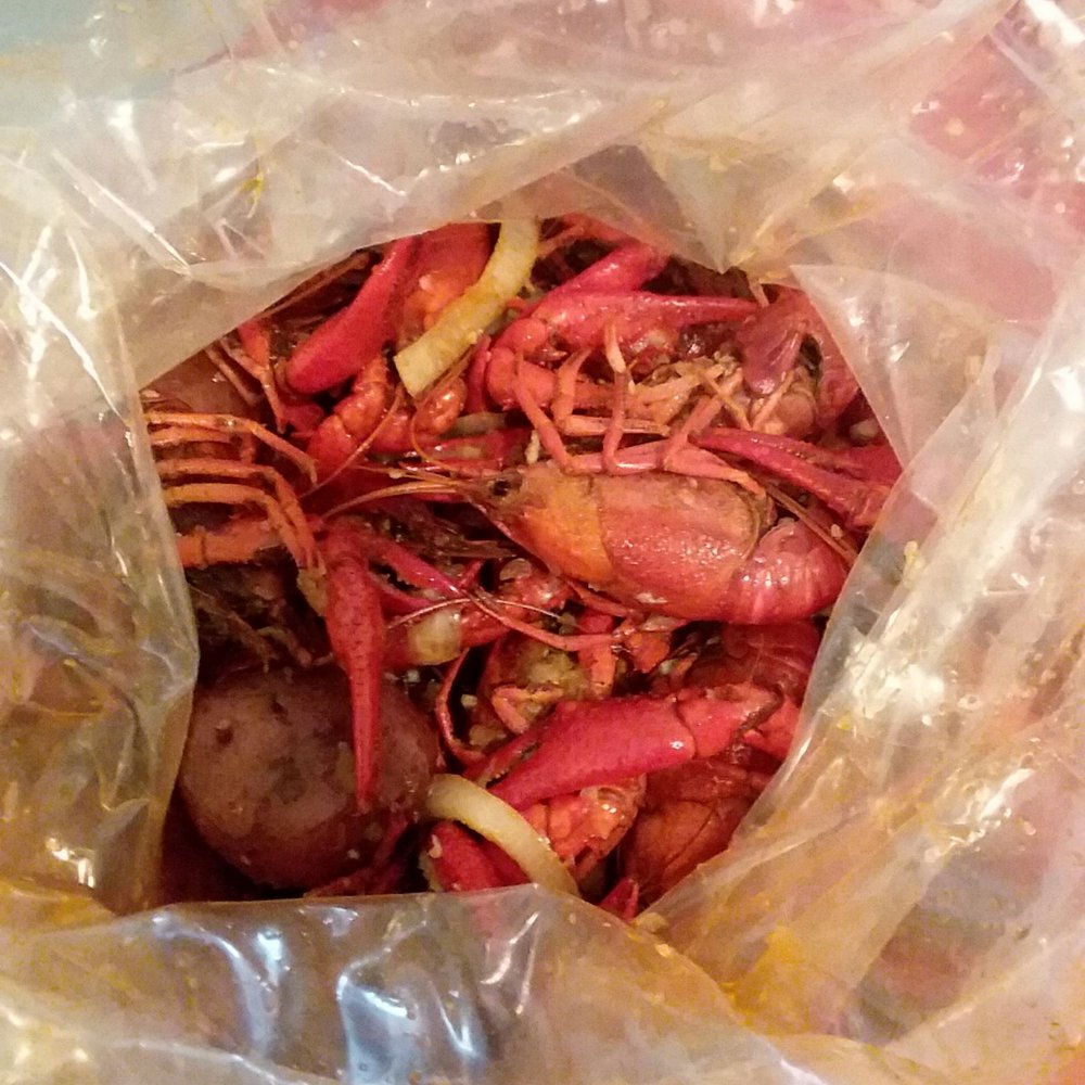 Kajun Seafood & Wings - a close up of a bag of food - Seafood Near Me - Beaumont, Texas Kajun Seafood & Wings - a close up of a bag of food - Seafood Near Me - Beaumont, Texas