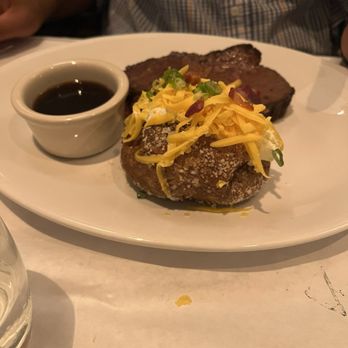 Bricktop's - Ribeye with au jus and a loaded baked potato - Steakhouses Near Me - Greenville, South Carolina