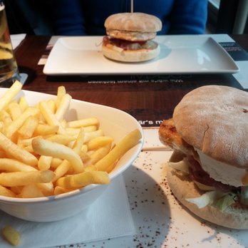 Rancho Grande - Chicken burger with goat's cheese and fig jam. In the back a salmon burger. - Steakhouses Near Me - Neumünster, SH Rancho Grande - Chicken burger with goat's cheese and fig jam. In the back a salmon burger. - Steakhouses Near Me - Neumünster, SH