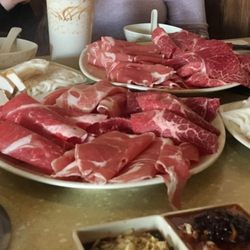 Asian Express Hot Pot - Hot pot meats and electric stove on table