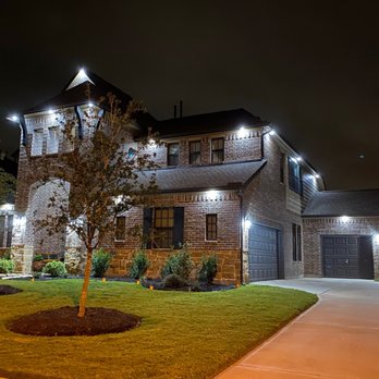 ReAmp Construction - a large brick house at night - Lighting Fixtures & Equipment Near Me ReAmp Construction - a large brick house at night - Lighting Fixtures & Equipment Near Me