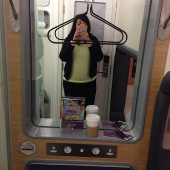 Yotel - Mirror with stow-away table below and extra storage underneath. Bathroom to left and bed to right - Hotels Near Me - Hounslow, XGL Yotel - Mirror with stow-away table below and extra storage underneath. Bathroom to left and bed to right - Hotels Near Me - Hounslow, XGL
