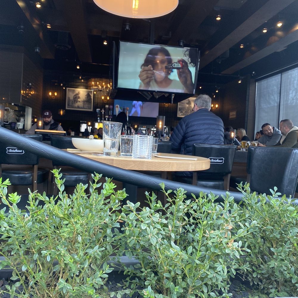Browns Socialhouse Panorama - people sitting at a table - Pubs Near Me - Surrey, British Columbia