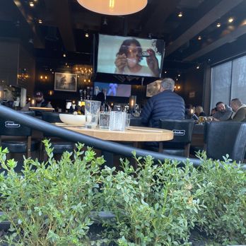 Browns Socialhouse Panorama - people sitting at a table - Pubs Near Me - Surrey, British Columbia Browns Socialhouse Panorama - people sitting at a table - Pubs Near Me - Surrey, British Columbia